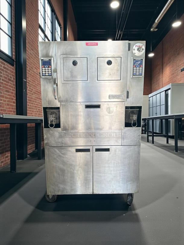 Stainless steel Autocrat coffee vending machine with dual dispensers and keypads, used condition, visible markings.