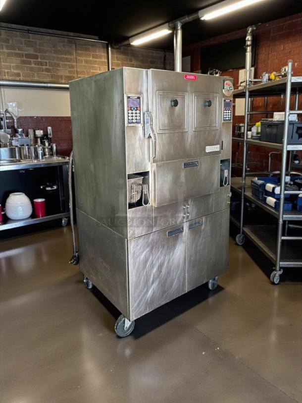 Alto-Shaam AutoFry MTI-10 commercial deep fryer, stainless steel, used condition, programmable keypad, on casters for mobility.