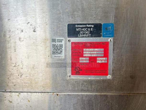 Motion Technology MTI-40C commercial cooking appliance label. Displays serial number, model, voltage, and wattage details.
