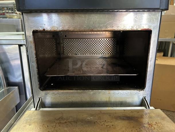 Merrychef Eikon e2s ventless high-speed countertop oven, 208/240V, great condition, tested, stainless interior, visible wear.