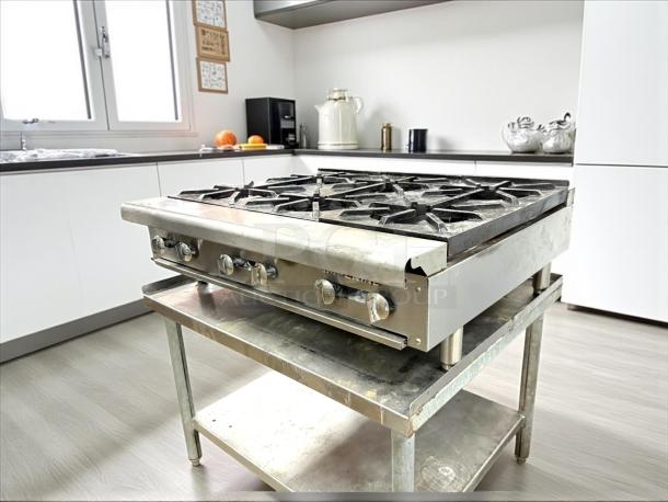 Imperial IHPA-6-36 36" gas hotplate with 6 burners, excellent condition, tested and working.
