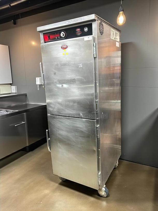 FWE UHST-13-OTB heated meal delivery cart, 13 trays, stainless steel, tested, 120v, excellent condition, visible control panel.