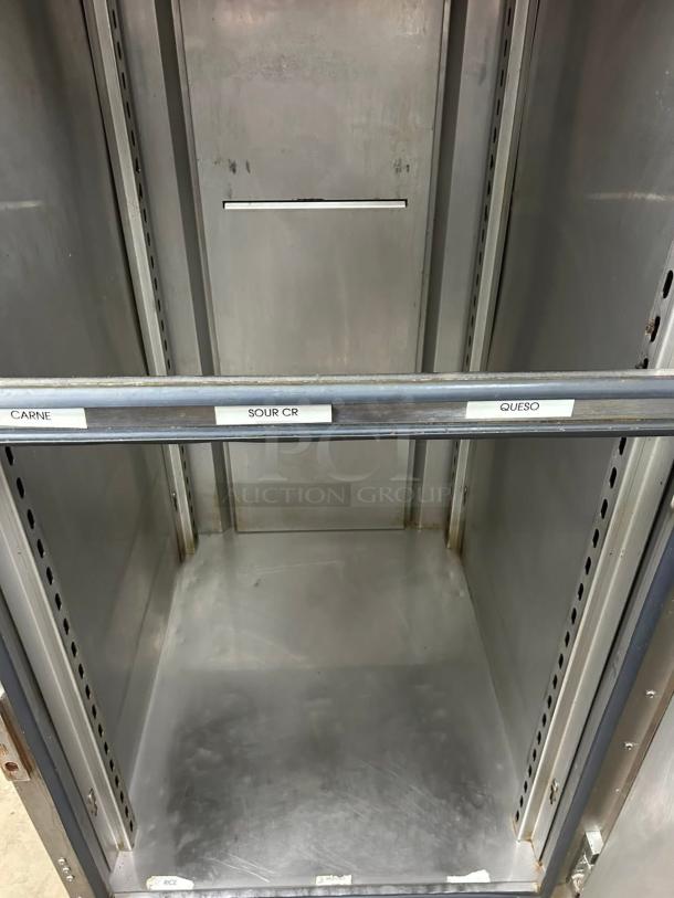 FWE UHST-13-OTB heated meal delivery cart with 13 tray slots, shown in amazing condition. Labels indicate contents.