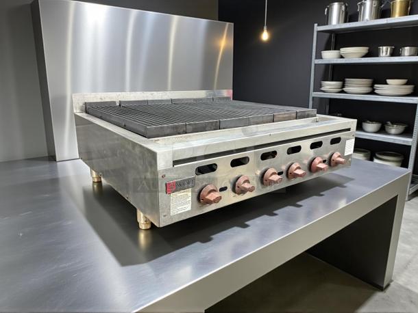 Wolf ACB36 36" gas charbroiler with 6 burners and cast iron grates. Natural gas, tested and working, stainless steel.