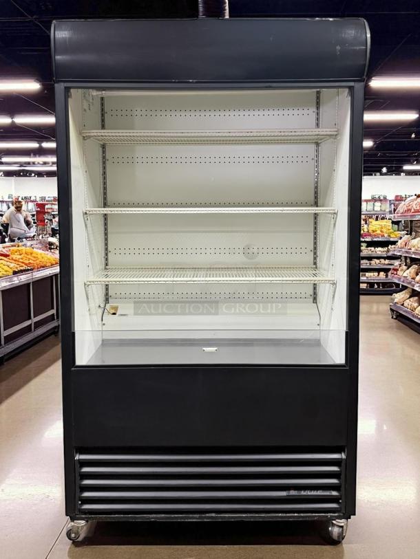 True TAC-48 Vertical Air Curtain Merchandiser, 34 Cu. Ft., black, excellent condition, tested and working, 115v power.