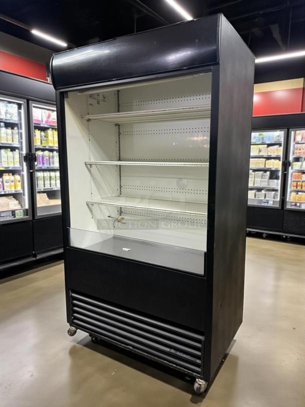 True TAC-48 air curtain merchandiser, 34 cu. ft., black, great condition, 115v, tested and working, shelves included.