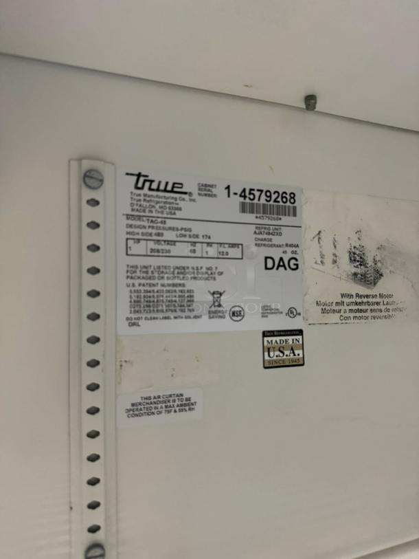 True TAC-48 air curtain display label showing model, serial number, and specifications. Made in USA.