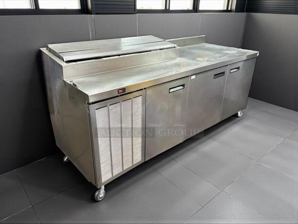 Delfield 000-20191PTC 91" 3-door refrigerated pizza prep table on casters, stainless steel, tested, working condition.