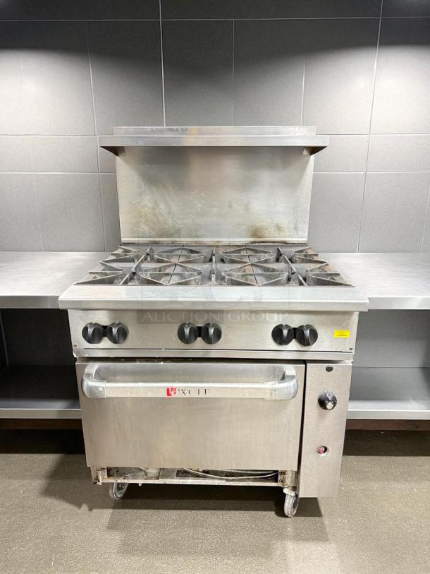 WOLF 36C-Y1R range with 6 burners, standard oven. Stainless steel, natural gas, used condition, tested and working.
