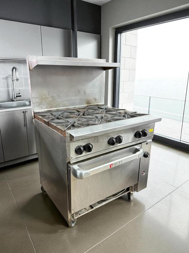 WOLF 36C-Y1R 6-burner range with oven, stainless steel, tested and working, visible wear, commercial-grade.