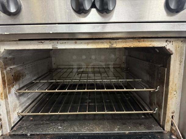 Wolf Commercial 36C-Y1R Challenger XL gas range with 6 burners and standard oven, showing interior racks, tested and working.