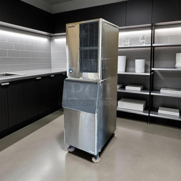 Hoshizaki KM-500MAH ice machine, tested and working, 500LB capacity, 115V, stainless steel, visible wear, on wheels.