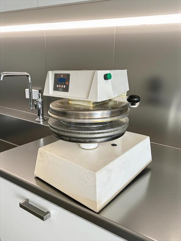 Proluxe DP2350S 17" Automatic Pizza Dough Press, great condition, tested and working, white base, control panel visible.