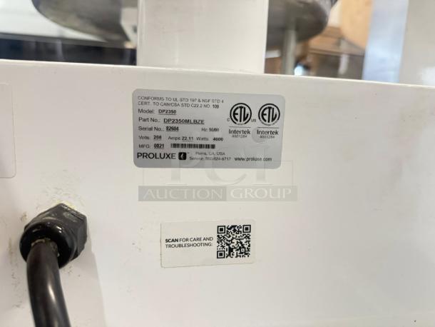 Proluxe DP2350S pizza dough press, 17" automatic, 208V, part no. DP2350MLBZE. Great condition, tested and working, showing labels.