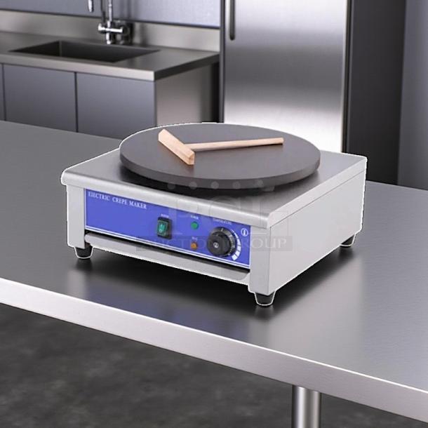 Italy Model HE-1E electric crepe maker, 17.7" round plate, 115v, tested and working, in great condition, on a metal surface.