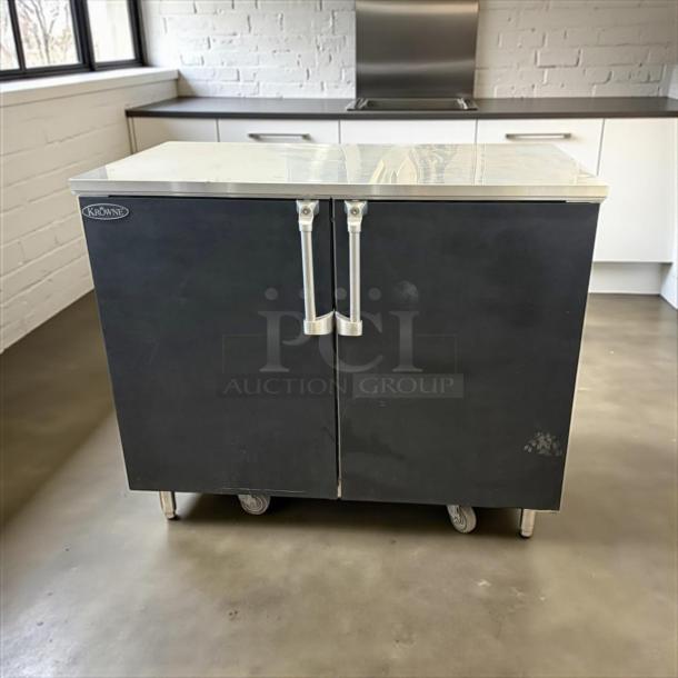 Krowne BR48 48" dry, non-refrigerated back bar cabinet with 2 solid doors. Black finish, excellent condition, tested working.