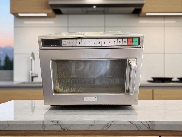 Panasonic NE-17723 1700W commercial microwave in good condition, features 3-stage cooking, keypad controls, and tested working.