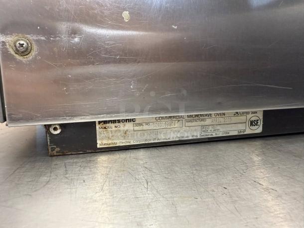 Panasonic NE-17723 1700W commercial microwave oven, tested and working. Features 3-stage cooking. Manufacturer label visible.