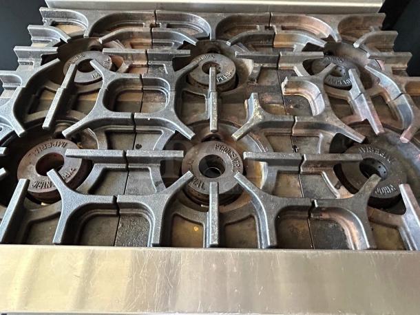 Imperial Range IR-6NG Pro Series 36" natural gas range, featuring 6 burners, in great condition, showcasing cast iron grates.