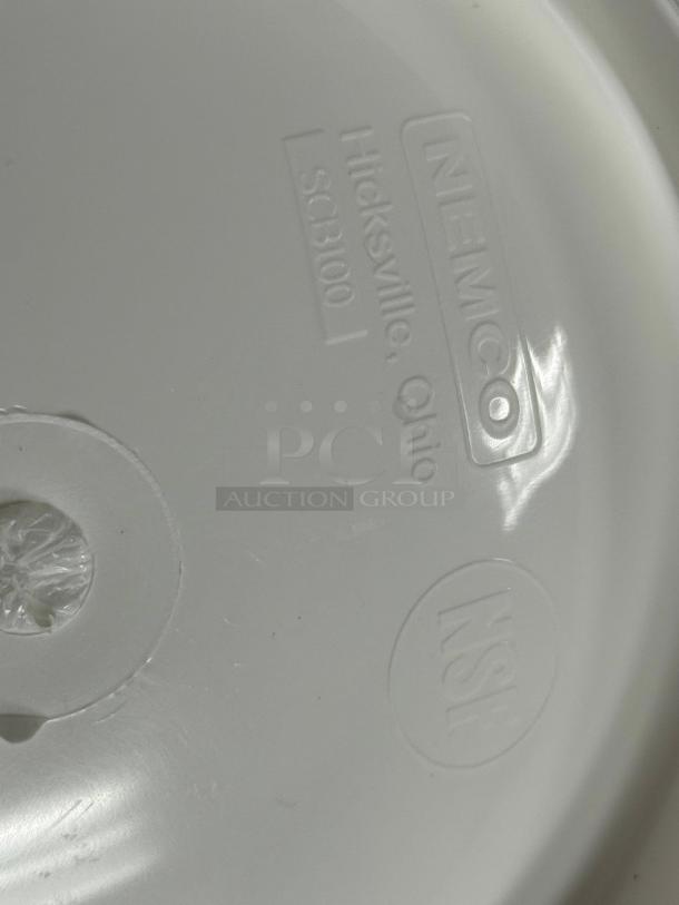 Brand new Nemco white plastic bowls featuring markings of Nemco, Hicksville, Ohio, SCB100, and NSF logo for quality assurance.