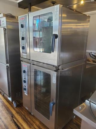 Rational Combi Master Plus oven on casters. Stainless steel, electric. Features dual glass doors, control panel with dials.
