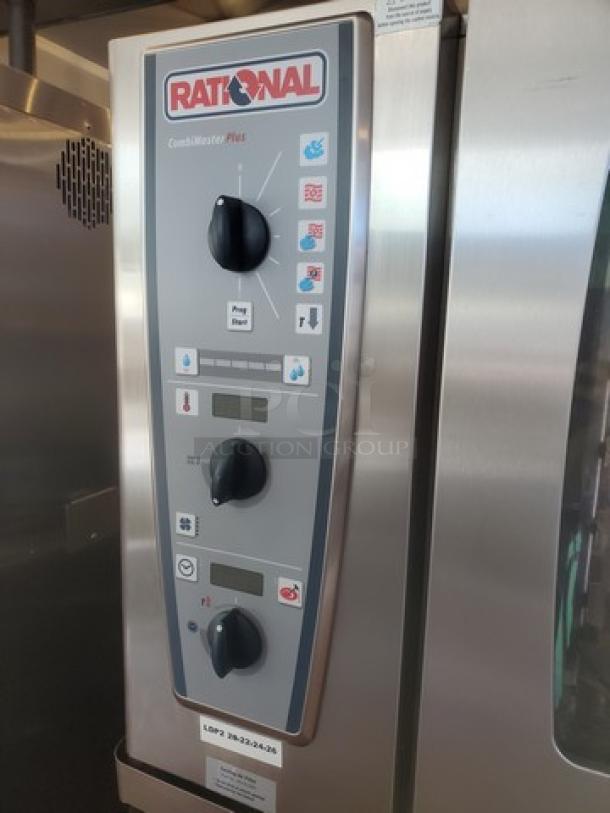 Rational Combi Master Plus electric oven, on casters, control panel with dials and digital display, stainless steel finish.