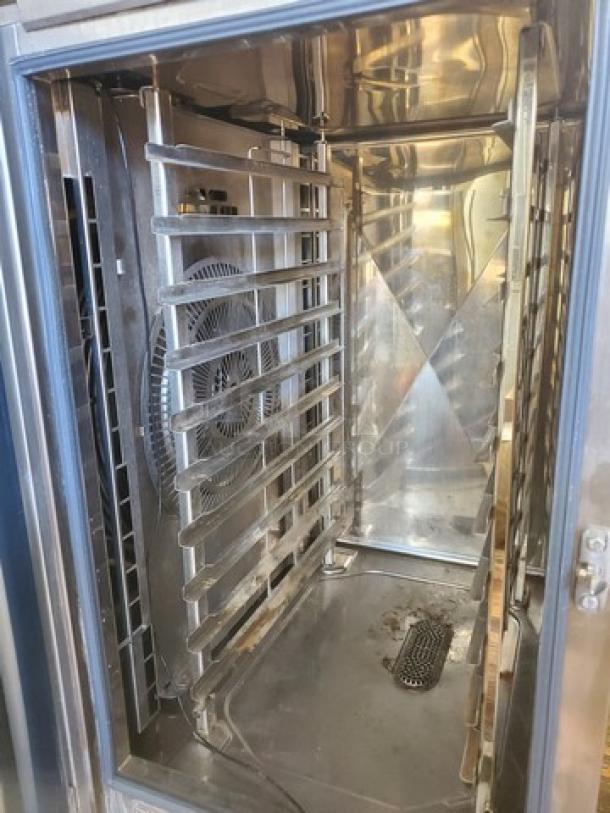 Rational Combi Master Plus oven, electric, on casters, stainless steel interior, visible fan, drain, used condition.