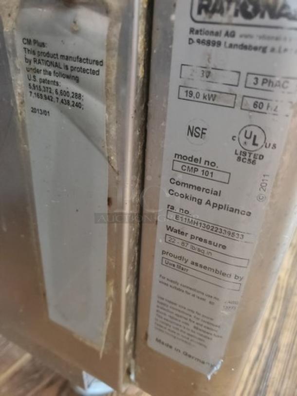 Rational Combi Master Plus electric oven, model CMP 101, on casters. Features labels showing specs, patents, and certifications.