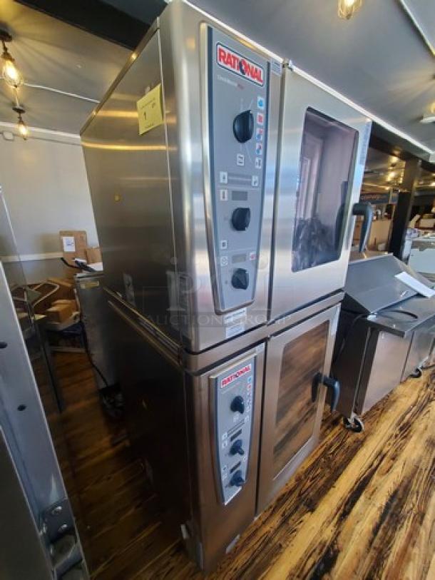 Rational Combi Master Plus, electric oven on casters. Stainless steel, multiple control knobs, visible branding. Excellent condition.