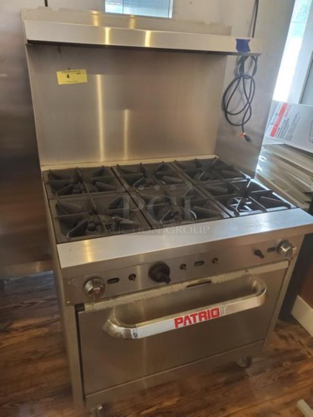 Patriot 6 Burner Range, Model FMGR-36/NG, natural gas, 210,000 BTU, on casters, missing 3 knobs, stainless steel finish.