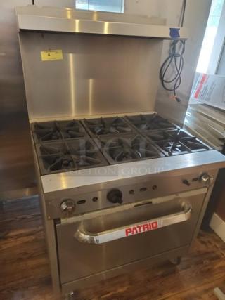 Patriot 6 Burner Range, Model FMGR-36/NG, natural gas, 210,000 BTU, on casters, missing 3 knobs, stainless steel finish.