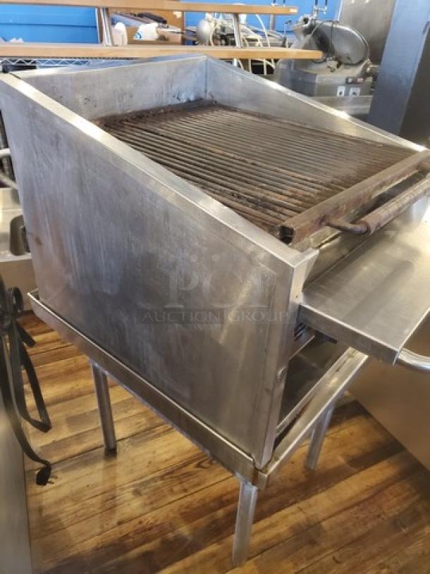 MagiKitch'n Model CM624 Charbroiler, stainless steel, shows signs of use; ideal for commercial kitchens.