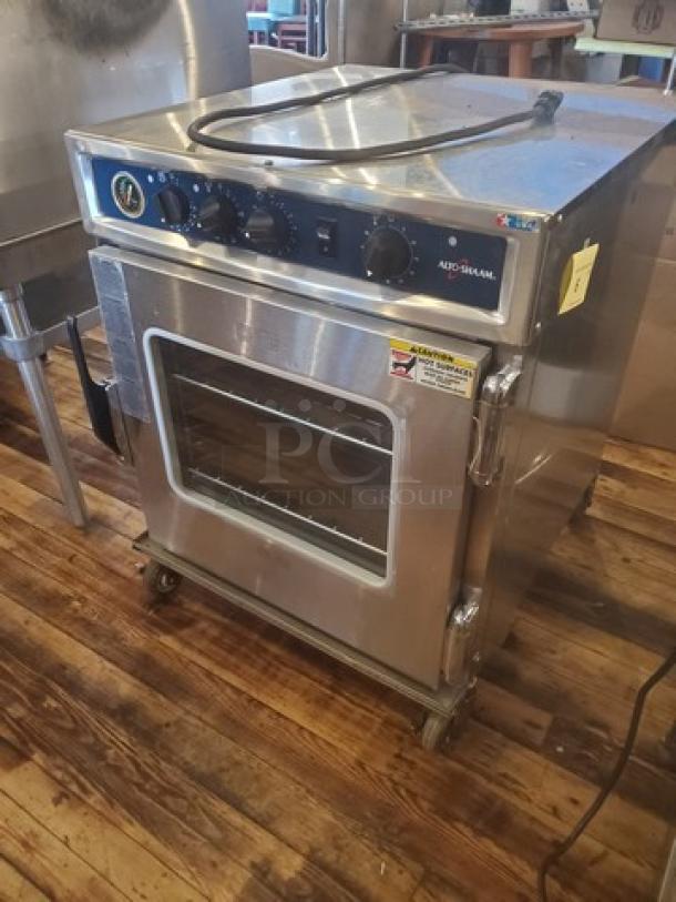 Alto Shaam 767-SK undercounter cook and hold smoker oven, stainless steel, 125V, 1 PH, 60 Hz, 1920W, on casters.