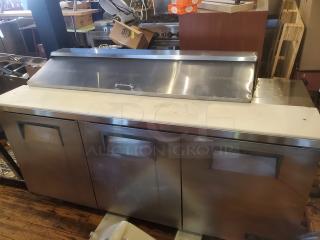 True TSSU-72-16 72" sandwich/salad prep table, stainless steel, 1/2 HP, 115V, 60Hz, needs caster replacement.