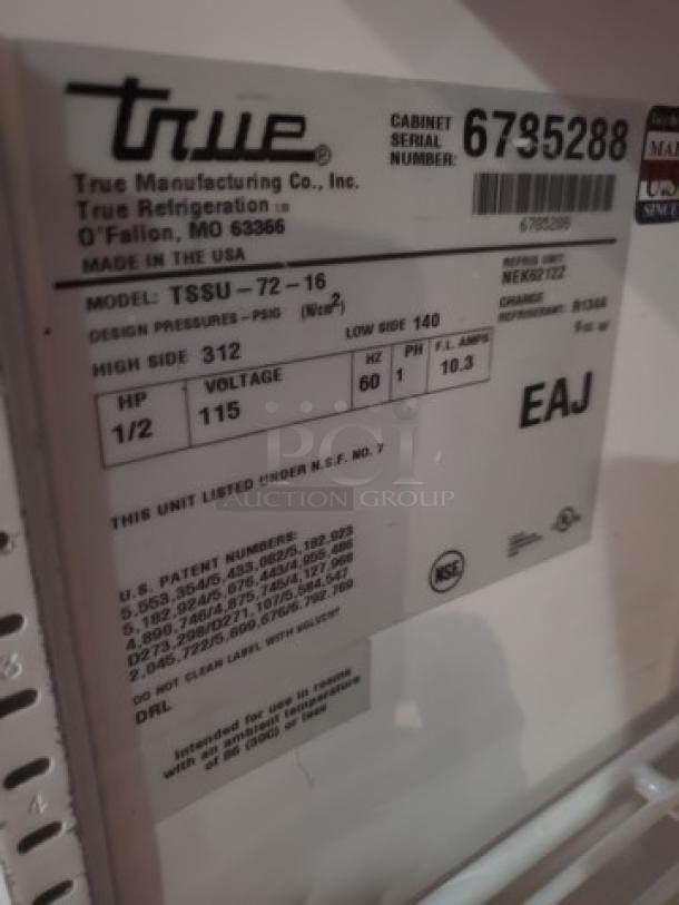 True TSSU-72-16 Sandwich/Salad Prep Table label showing model, specs: 1/2 HP, 115 V. Casters need replacement.