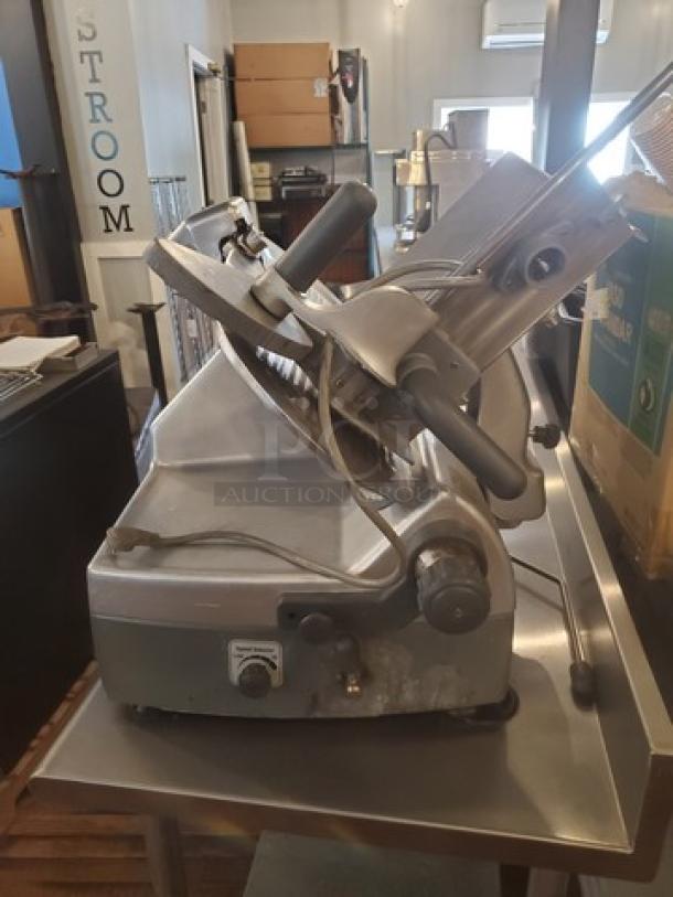 Hobart 2912 12" Automatic Meat Slicer, 1 PH, 120V, 6A, 60 Hz, 1/2 HP. Used condition, sturdy metal body.