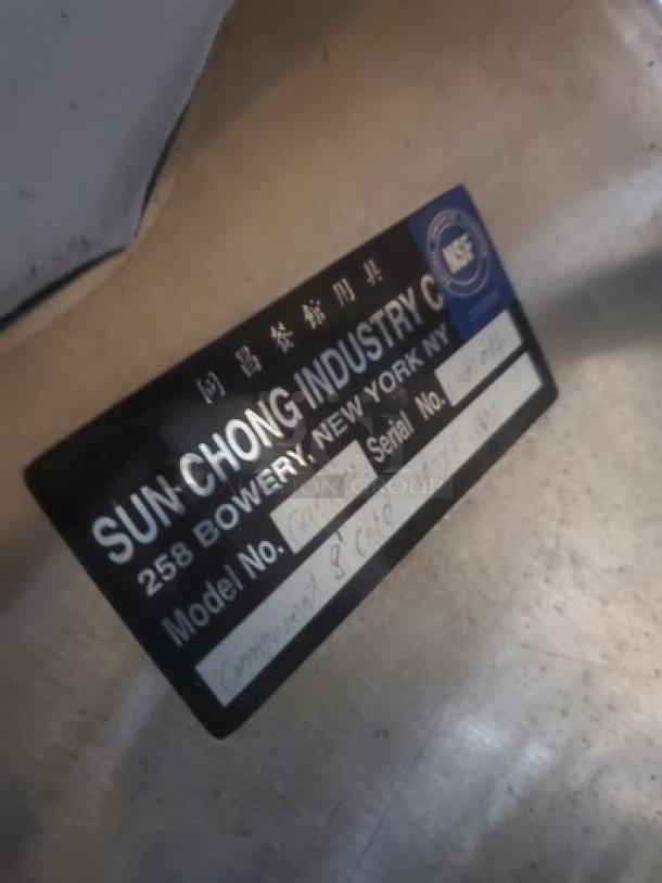 Sun Chong Industry Custom Cold Food Well label, showing model and serial number details for auction item identification.