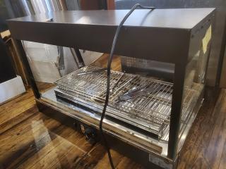Vollrath FMA7036 hot food cabinet, 120V, 1440W, 12.5A, 60 Hz, 1 PH, metal frame, glass sides, visible power cord, good condition.