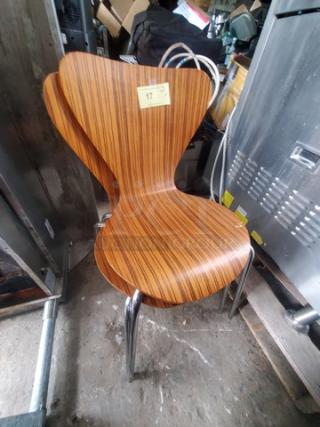 Lot of 2 modern wood chairs with chrome legs, striped wood veneer finish, excellent condition, visible sticker shows number "17".