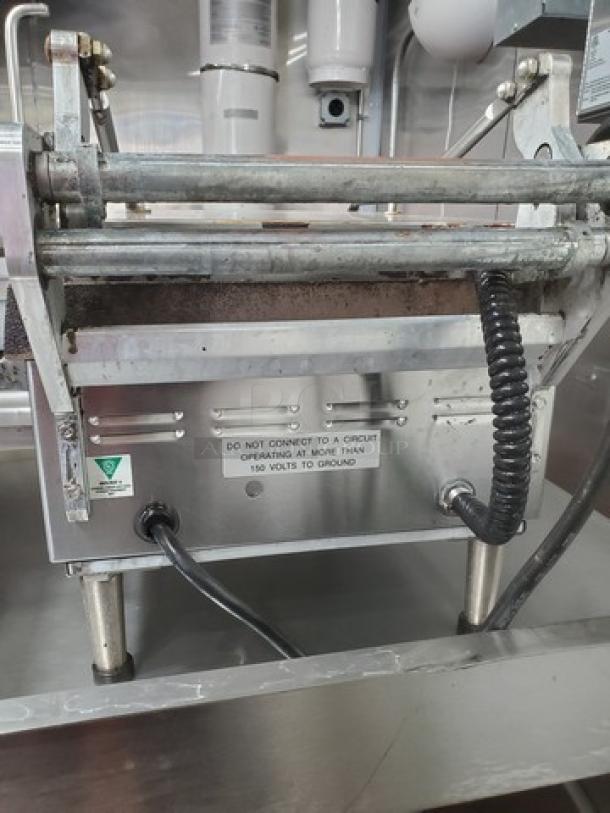 Pro-Max GR14I 14"x14" two-sided smooth grill in stainless steel; missing screw on one handle; caution label visible.