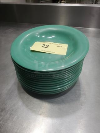 Lot of 12 GET B-139 melamine plates, 9" diameter, green, stackable. Auction tag on top plate, marked "22."