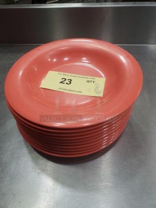 Lot of 10 GET B-139 9" melamine plates, coral color, good condition, stack on metal surface, auction tag "23 QTY 10".