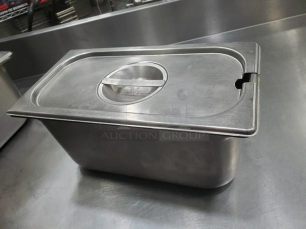 Lot of 4 Vollrath 6.1 Qt stainless steel food pans with lids, used condition, ideal for commercial kitchens.