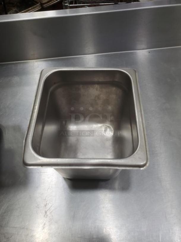 Lot of 7 stainless steel square food pans, 2.7 quarts each; durable, versatile, ideal for food service.