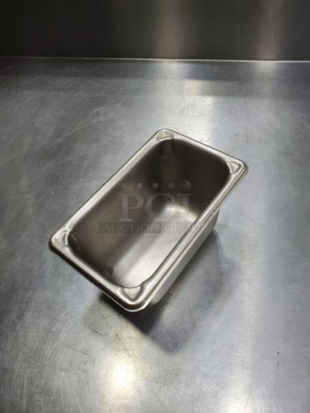 Lot of 10 stainless steel food pans, 1.1 quarts each. Durable construction, ideal for commercial kitchen use.