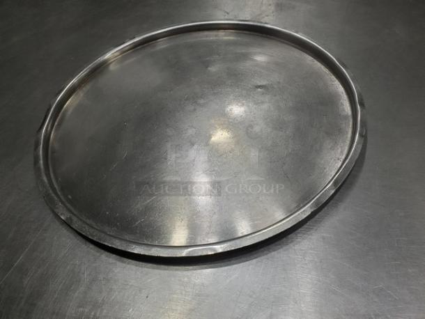 12" round stainless steel tray, shiny finish, smooth edges, gently used, no visible markings or labels.