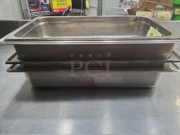 Lot of 5 stainless steel hotel pans in good condition, visible minor wear. Ideal for catering or commercial kitchen use.