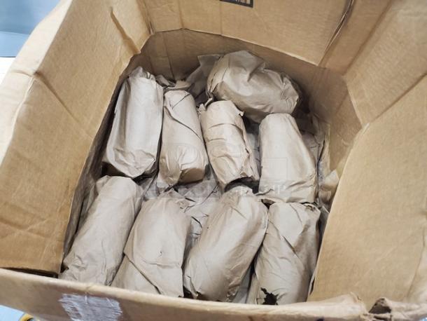 Box containing 19 glasses individually wrapped in brown paper for protection, condition appears new.