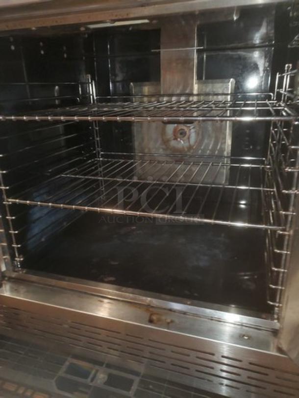 Imperial Natural Gas Convection Oven, stainless steel interior, includes multiple racks, good condition, no visible tags.