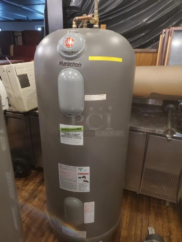 Marathon Heavy Duty 85 Gallon Non-Metallic Tall Electric Water Heater, Model MHD85245, features visible labeling and controls.